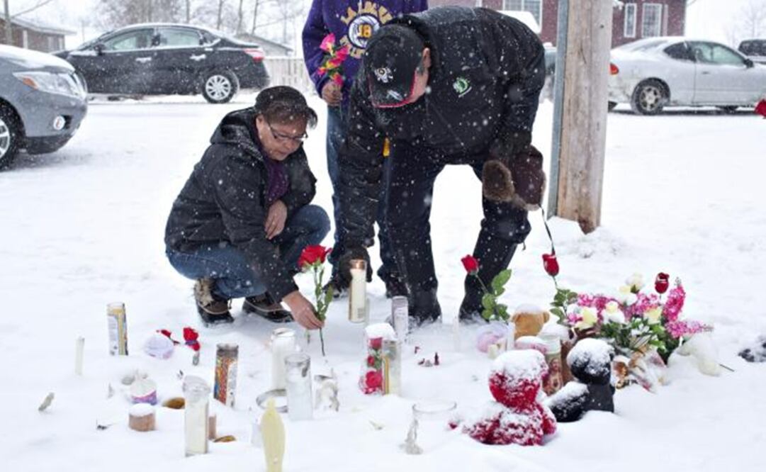 People are leaving candles and other things at the site of the killings. (Photo: AP)