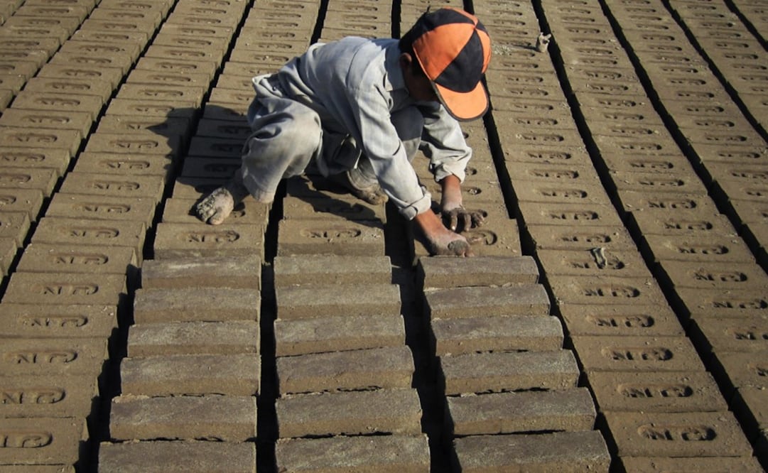 The bricks will be used to rebuild the area - Photo: Rahmat Gul/AP