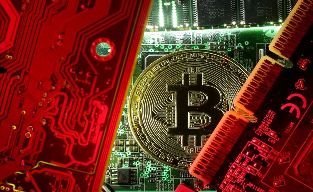 A copy of bitcoin standing on PC motherboard -Photo: Dado Ruvic/REUTERS