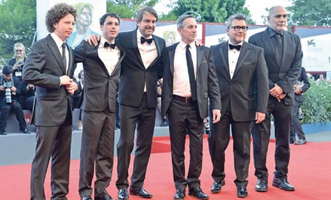 The team of "From Afar" upon their arrival to the red carpet. (Photo: AP/Invision)