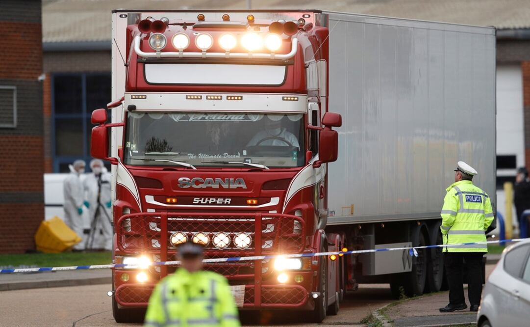 Police move the lorry container where bodies were discovered, in Grays, Essex, Britain - Photo: Peter Nicholls/REUTERS