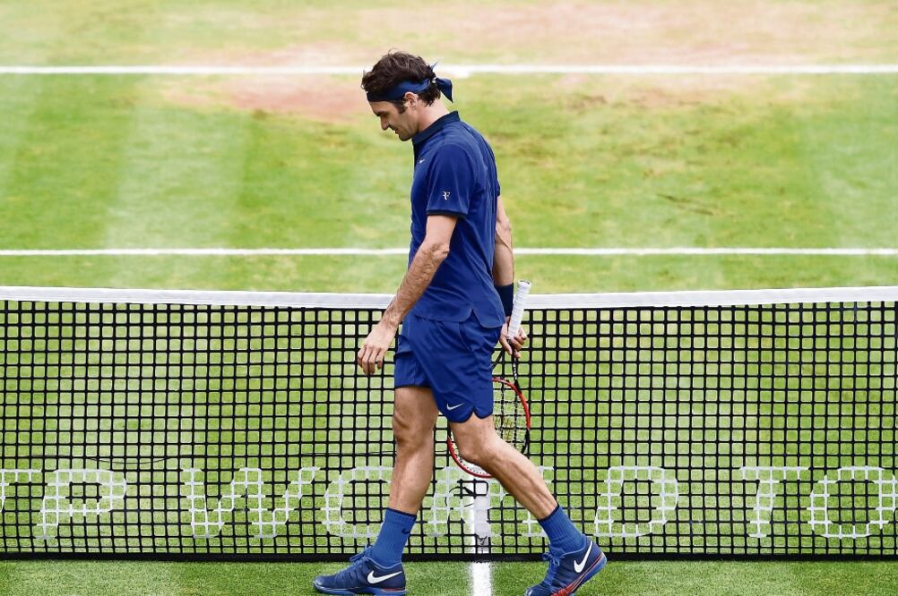 Roger quedó eliminado tras despediciar dos puntos para partido (MARIJAN MURAT. AP)