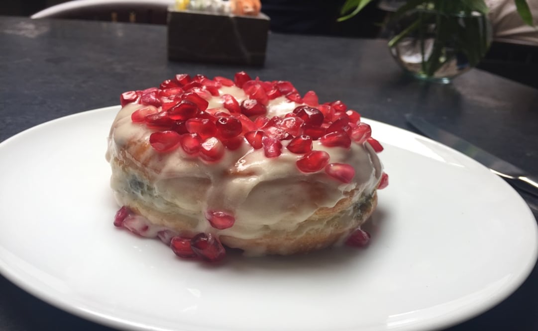 A decadent doughnut filled with a rich poblano pepper jam covered with a velvety nogada frosting festooned with pomegranate seeds is an absolute must for everybody that has a sweet tooth out there!