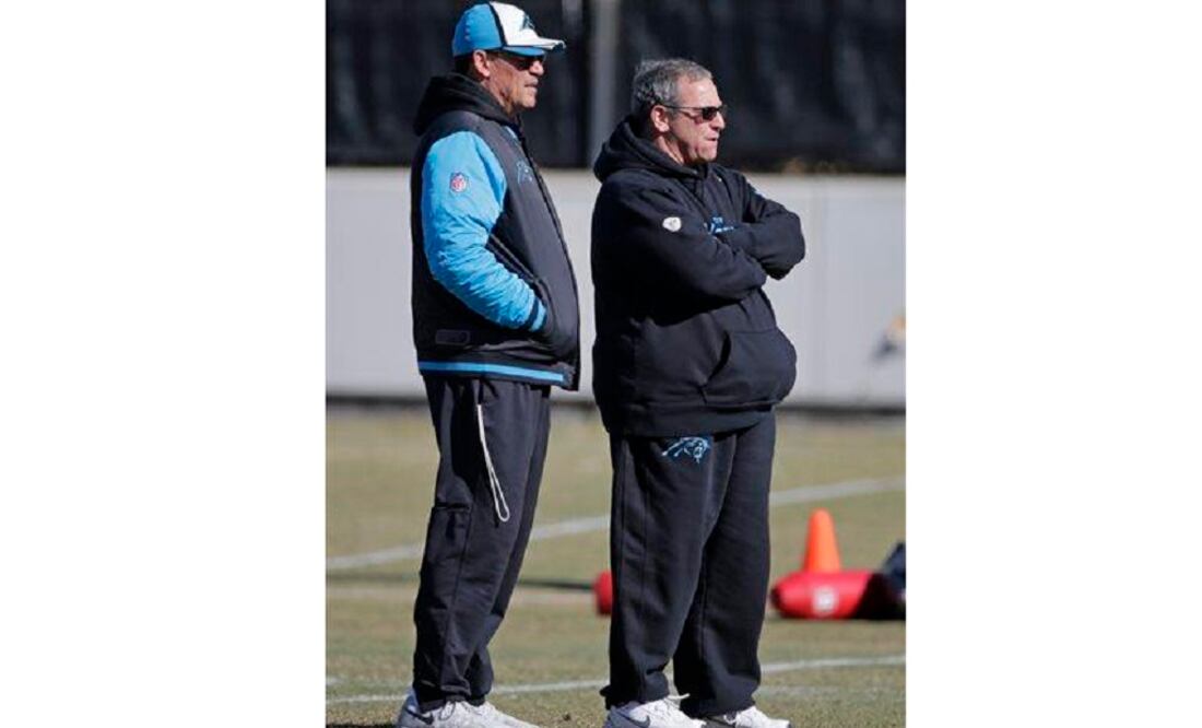 Carolina Panthers head coach Ron Rivera, left, and general manager Dave Gettleman, right, look on during NFL football practice in Charlotte. (Photo: AP)