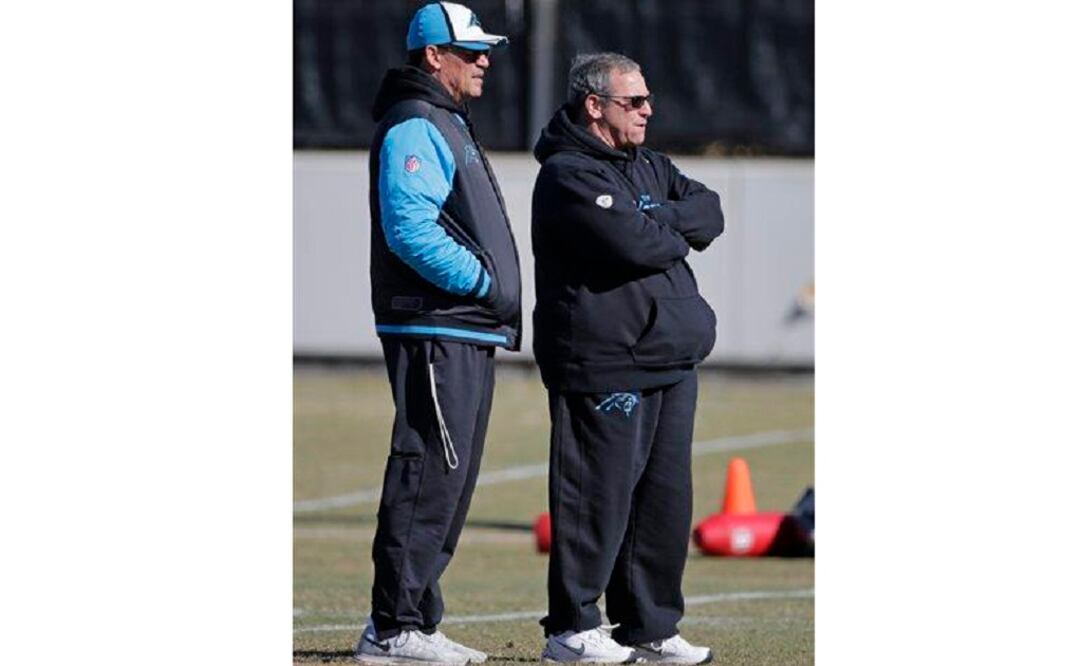 Carolina Panthers head coach Ron Rivera, left, and general manager Dave Gettleman, right, look on during NFL football practice in Charlotte. (Photo: AP)