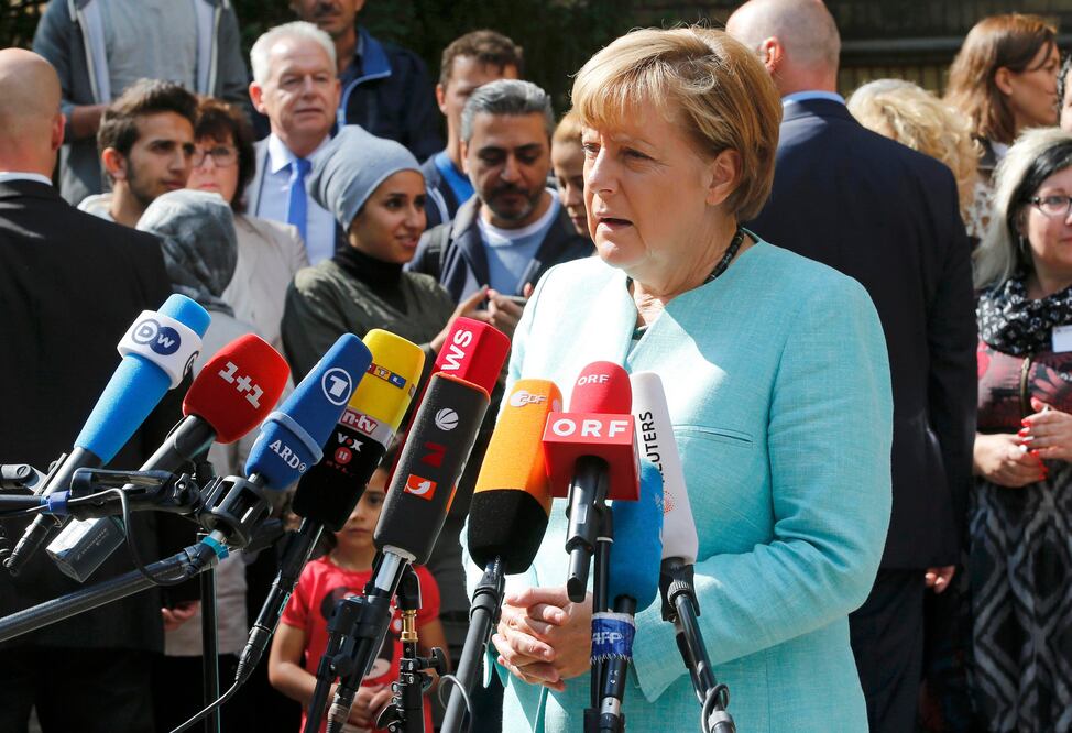 Ángela Merkel tras reunirse con refugiados (Reuters)