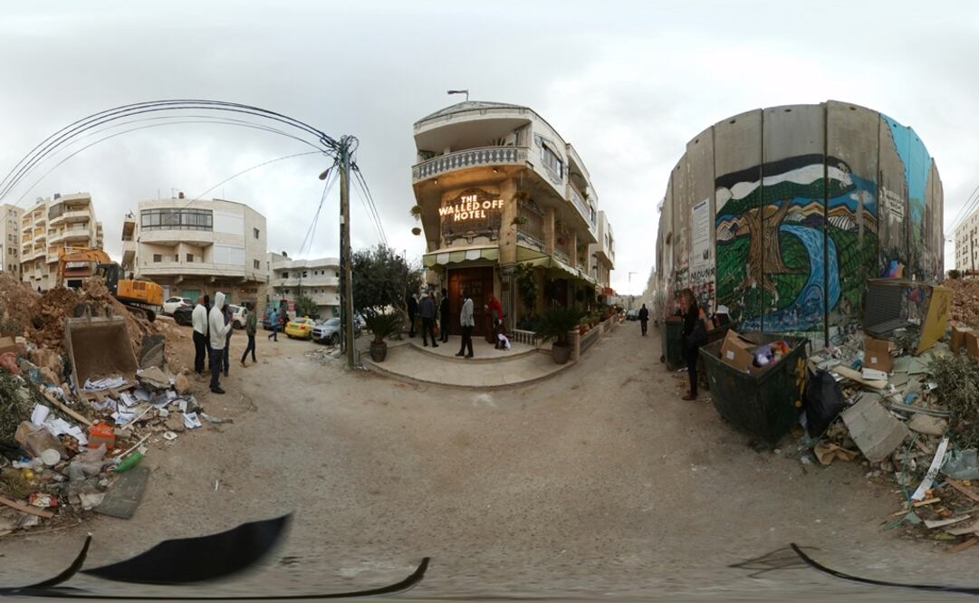Street artist Banksy's Walled Off hotel overlooks the concrete wall Israel has built in parts of the occupied West Bank in Bethlehem