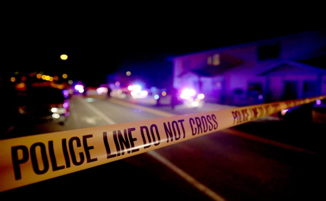 Police tape stretches across a section of street  - Photo: Jake Bacon/Arizona Daily Sun via AP