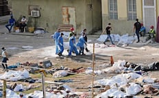 En La Guaira, equipos descargan pilas de cuerpos; zona cero en Venezuela está militarizada 