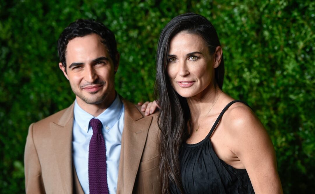 El diseñador de modas Zac Posen (i) con la actriz Demi Moore (d). Foto: Archivo