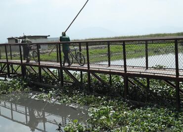 Colocan costales cerca del Río Lerma para evitar escurrimientos