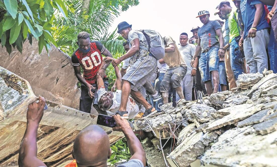 Fotos: Ralph Tedy, Duples Plymouth, Joseph Odelyn y Delot Jean. AP