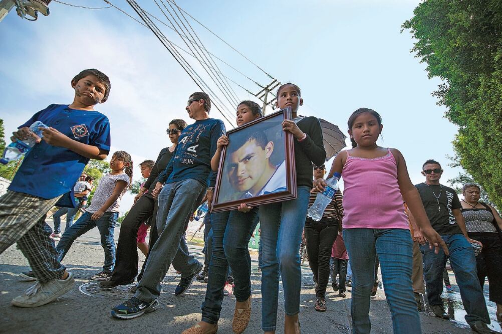 Familiares de las víctimas tuvieron que identificar a sus parientes mediante fotos de cuerpos mutilados