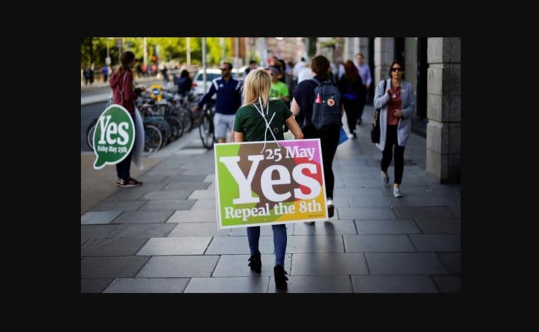 A woman carries a placard as Ireland holds a referendum on liberalising abortion laws, in Dublin - Photo: Max Rossi/REUTERS