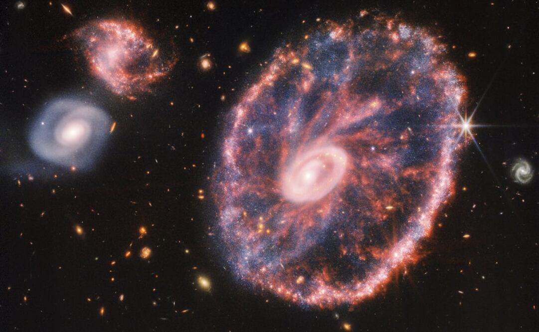 Telescopio James Webb captó dos galaxias compañeras con un telón de fondo de muchas otras galaxias.Foto: EFE/ NASA