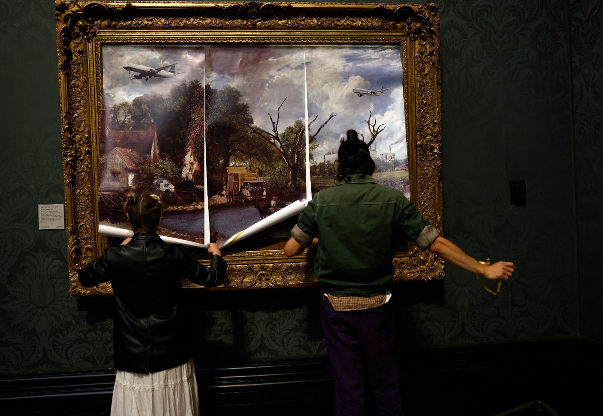 Activistas clim&aacute;ticos se pegan a un cuadro en la National Gallery